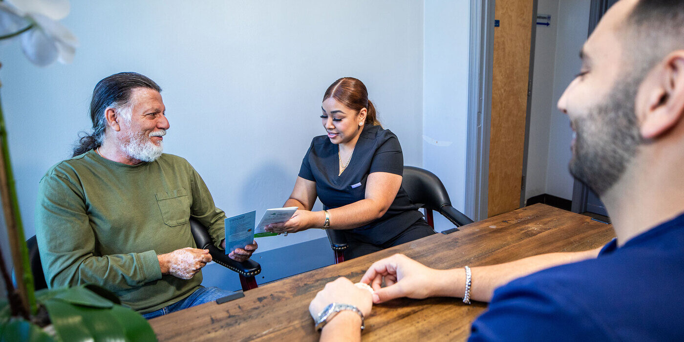An ADHP patient discussing treatment cost with the team