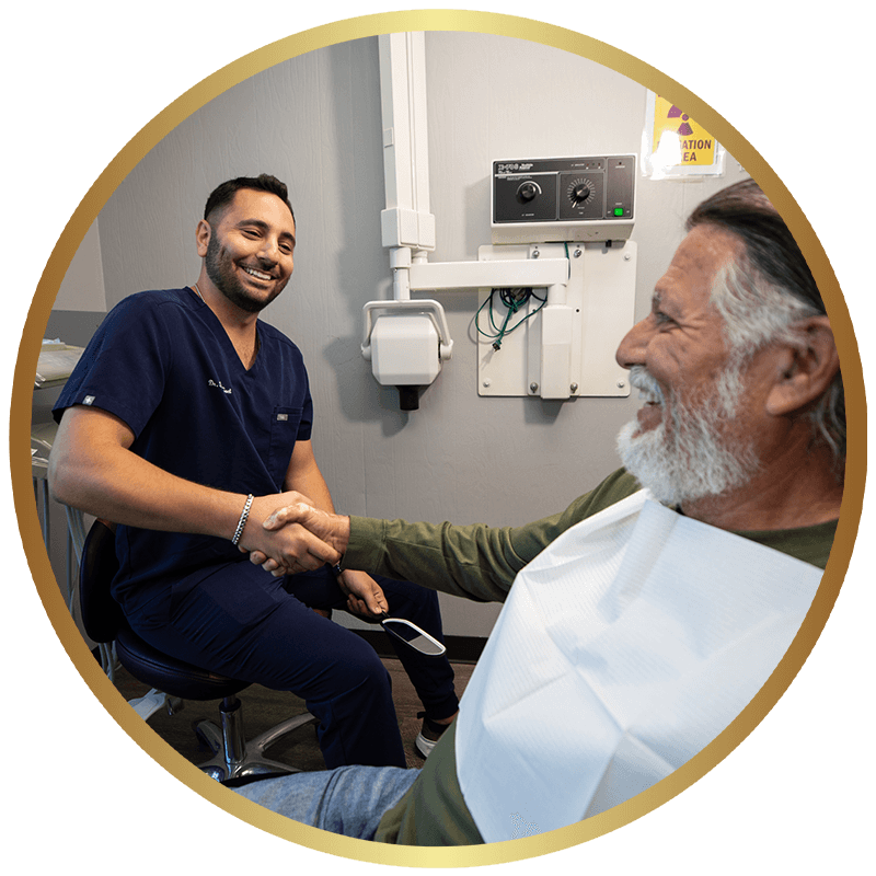 cohen with implant patient during dental surgery