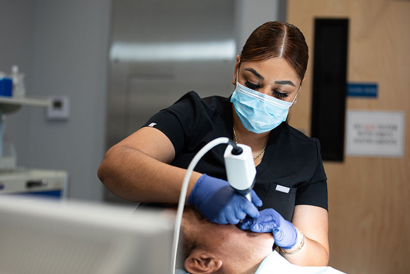 patient getting a 3d reading of their teeth